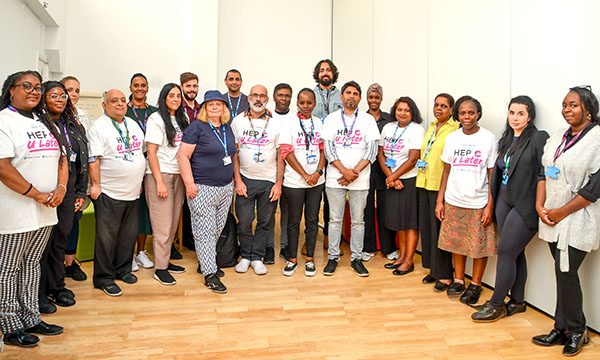 A photo of members of RCN Nursing Awards 2023 Team of the Year, the Addiction Recovery Community Hounslow, standing in a semi-circle