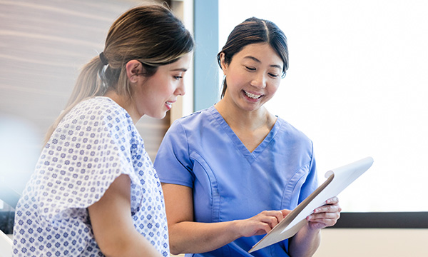 A nurse talks to a patient about their care plan