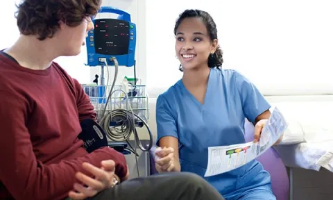 A nurse explaining to a patient