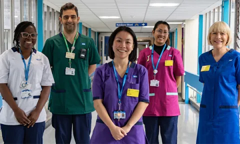 Nurses and allied health professionals wearing the new standard NHS uniform, which offer dress as well as scrubs option