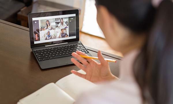 Woman on a laptop for a conference call