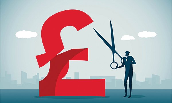 Nurse bank pay cuts: man ilustrated cutting a giant red pound sign with enormous scissors 