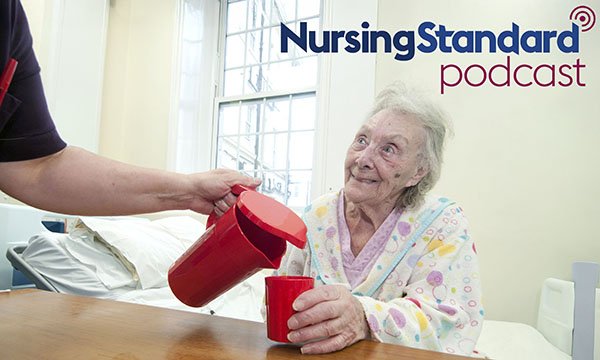 Managing dehydration: nurse giving water to patient
