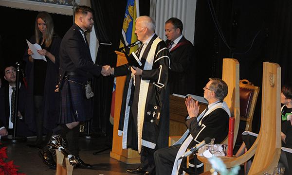 Family_tribute_to_inspiring_nursing_student_as_they_accept_posthumous_degree_Lyle_McDonald_with_Sir_Ian_Wood_tile.jpg