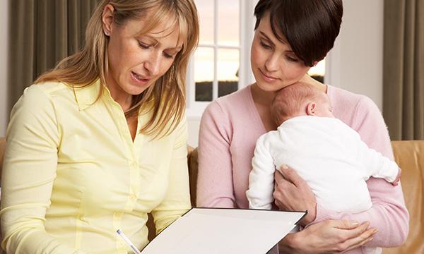 health visitor with mother and baby